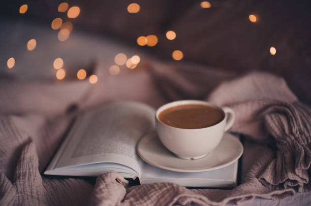 istock Cup of fresh coffee in bed 1220575612