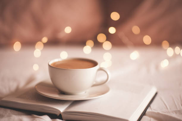 istock Cup of fresh coffee in bed 1220575684