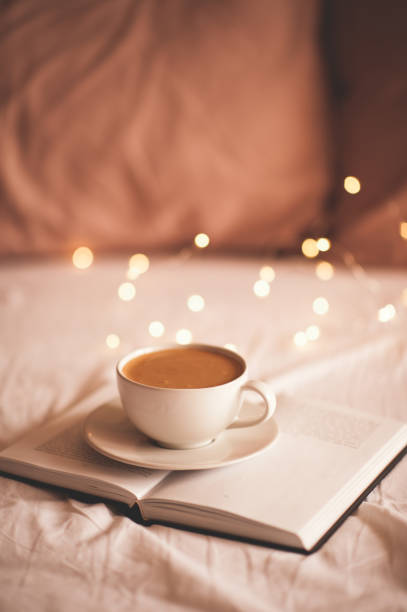 istock Cup of fresh coffee in bed 1220575688