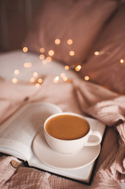 istock Cup of fresh coffee in bed 1220575704