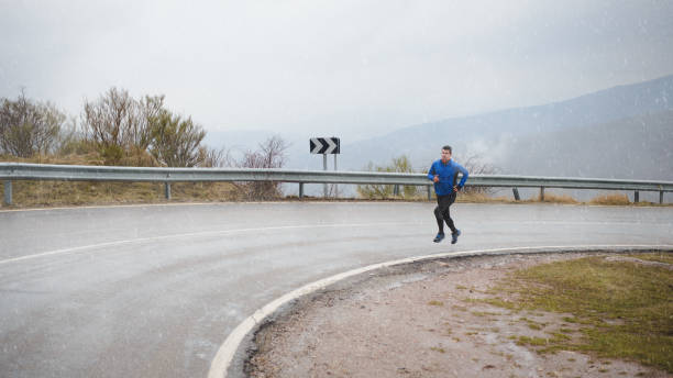 istock Winter running on mountain road 1220575781