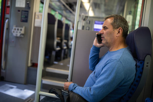 istock Mature tourist using phone while traveling with public transport 1220575854