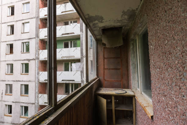 Balcony in abandoned ghost town Pripyat, post apocalyptic city, summer season in Chernobyl exclusion zone, Ukraine