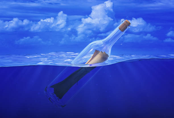 istock Message in bottle. Wine bottle corked with paper letter in ocean. 3d render 1220576833