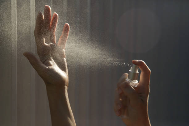 istock Hands spray. Antibacterial spray for hands. Woman spray hands sanitizer for preventive coronavirus spread. Epidemic prevention, disinfection, skin care concept. 1220577833