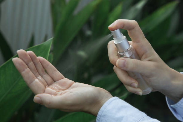 istock Hands spray. Antibacterial spray for hands. Woman spray hands sanitizer for preventive coronavirus spread. Epidemic prevention, disinfection, skin care concept. 1220577990