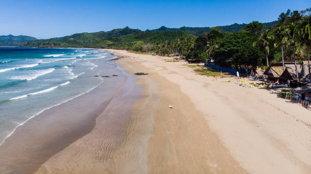 istock Surfing in Duli beach, El Nido, Palawan 1220578504