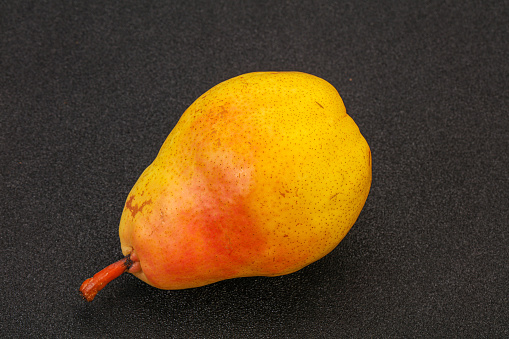 Fresh sweet yellow pear over background