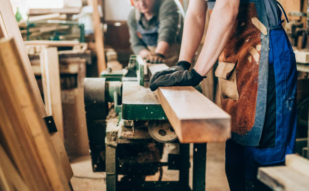 Carpenters working in wood workshop