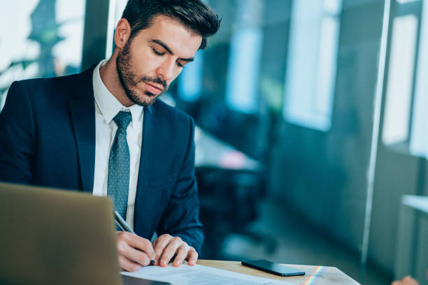 istock Businessman checking agreement before signing. 1220580224