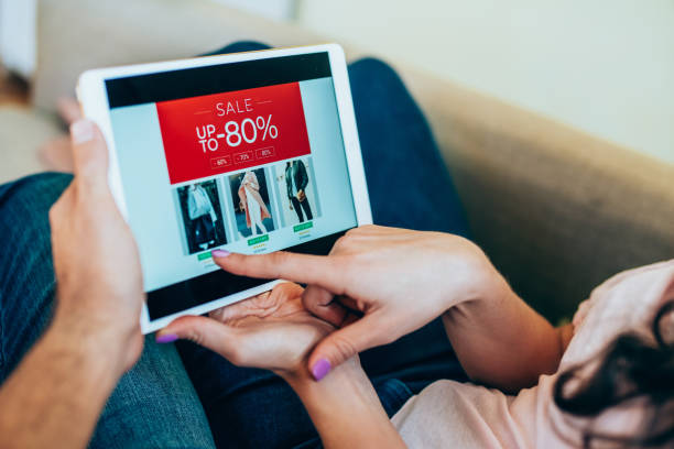 istock Couple shopping clothes online. 1220580297