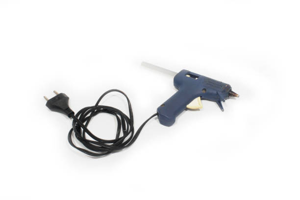 istock Electric hot glue gun isolated on white 1220580334