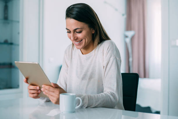 istock Woman texting at home. 1220581486