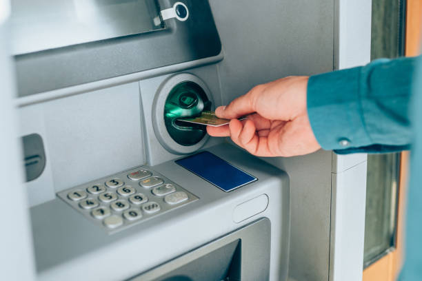 istock Man is withdrawing money from an ATM. 1220581523