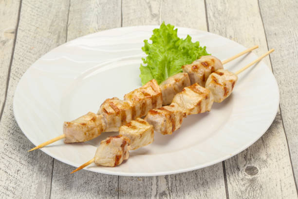 istock Grilled pork skewer served salad 1220581637