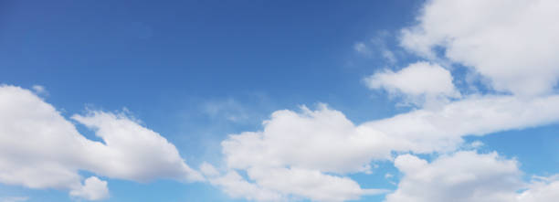 istock Blue sky background with white clouds. Summer concept. Abstract style for text, design, websites, bloggers, publications, pattern, animation. Banner. 1220582774