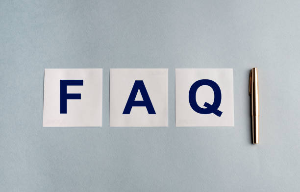 istock FAQ word on memo papers and pen isolated on blue grey background 1220585170
