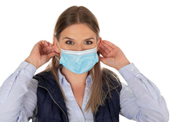 istock Woman with face mask on isolated 1220588387