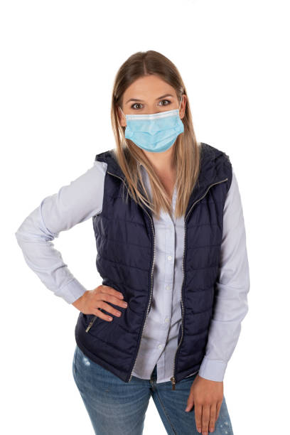 istock Woman with face mask on isolated 1220588628