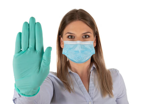 istock Woman with mask and gloves on isolated 1220588653