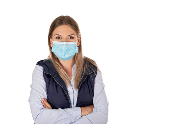 istock Woman with face mask on isolated 1220588697