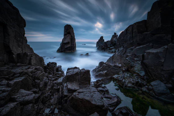 istock Rocky beach at sunrise 1220589860