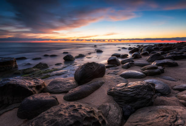 istock Rocky beach at sunrise 1220590063
