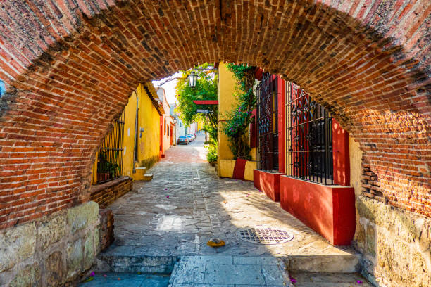old town of Oaxaca, Mexico arch and alley in the old town of Oaxaca oaxaca city photos stock pictures, royalty-free photos & images