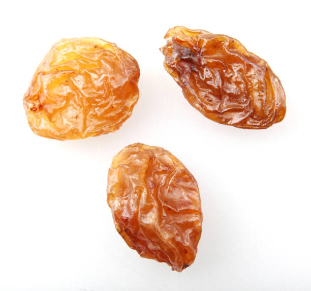 istock Image of raisins (aka sultanas) isolated on white background 1220595152