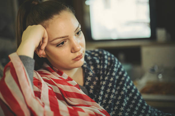 istock A pretty girl with an American flag 1220596980