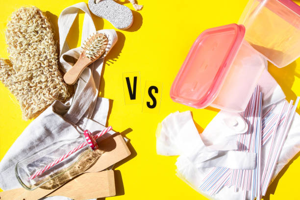 istock Zero waste eco friendly reusable objects such as reusable linen shopping bags, glass jars and wooden hairbrush vs plastic single-use objects 1220598317