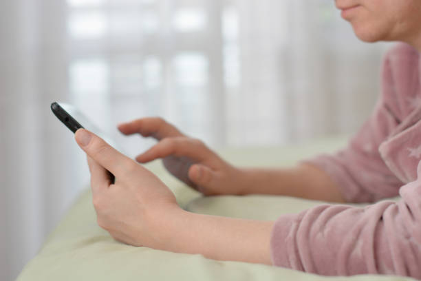 istock Relaxed woman using tablet pc in the morning  at home 1220599328