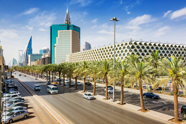 King Fahd Road in downtown Riyadh Saudi Arabia National Library Cars drive past the landmark King Fahd National Library on King Fahd Road in Riyadh Saudi Arabia on a sunny day. riyadh photos stock pictures, royalty-free photos & images