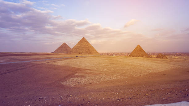 istock Pyramids of Giza with city view background 1220602936