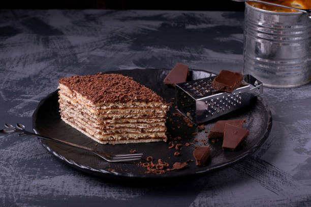 istock Mikado cake with caramel and chocolate buttercream on the black ceramic plate 1220603085