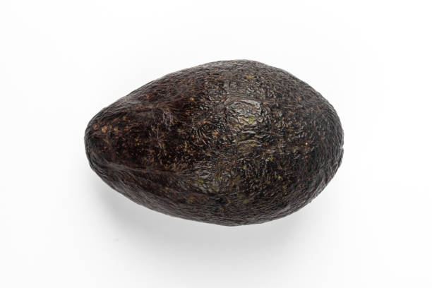 istock Ripe avocado isolated on blue background 1220603094