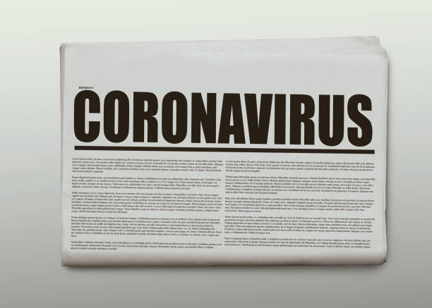 istock Coronavirus written headlined newspaper isolated on a white background 1220603119
