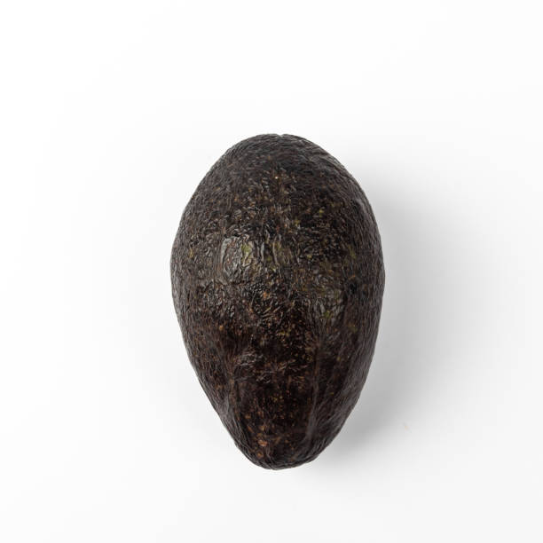 istock Ripe avocado isolated on blue background 1220603180