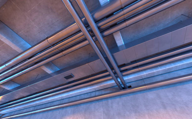 istock Pipes and air ducts on a concrete ceiling 1220603479