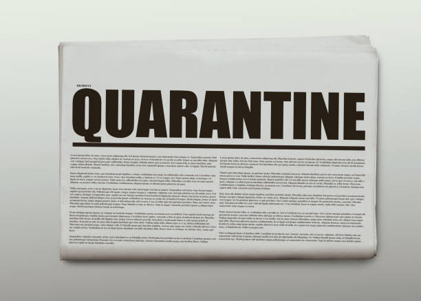 istock Quarantine written headlined newspaper isolated on a white background 1220603580