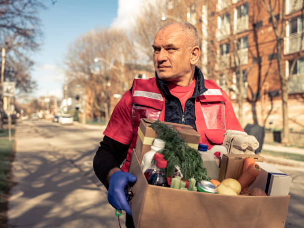 istock COVID-19, Donation Home food delivery during lockdown 1220607419