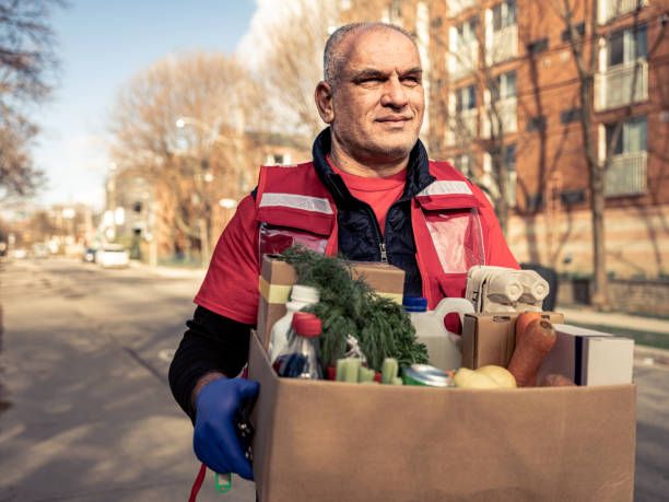 istock COVID-19, Donation Home food delivery during lockdown 1220607420
