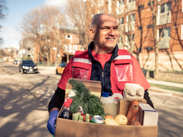istock COVID-19, Donation Home food delivery during lockdown 1220607424