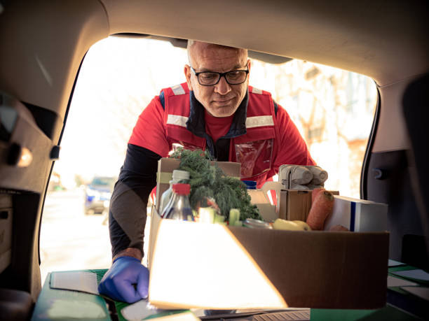 istock COVID-19, Donation Home food delivery during lockdown 1220607652