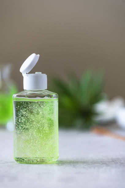 Bottle of homemade hand sanitizer in bottles and ingredients stock photo
