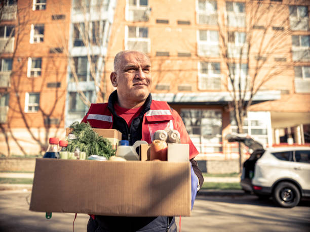 istock COVID-19, Donation Home food delivery during lockdown 1220608091