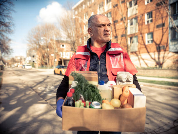 istock COVID-19, Donation Home food delivery during lockdown 1220608239