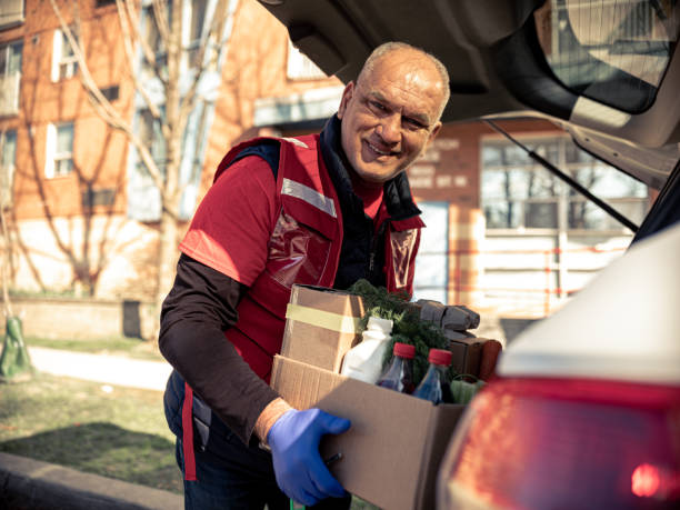 istock COVID-19, Donation Home food delivery during lockdown 1220608335