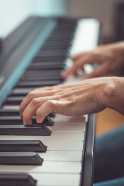 istock Woman and her piano in home 1220610880