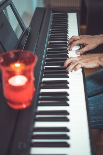 istock Woman and her piano in home 1220611029